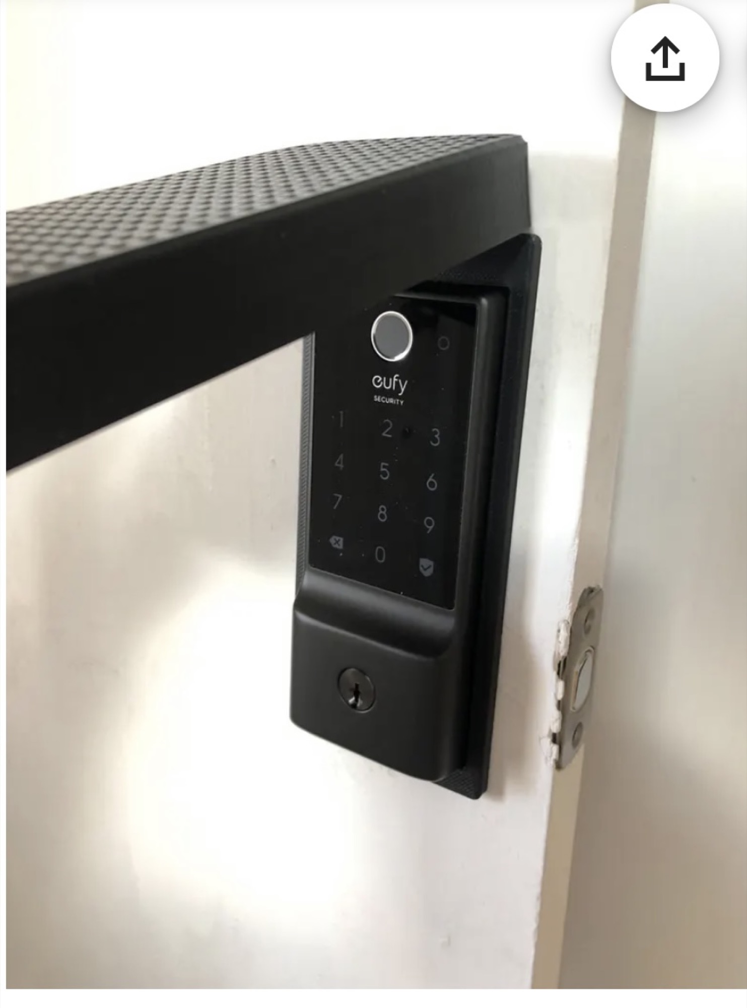 Eufy Security fingerprint and keypad deadbolt installed on a black door