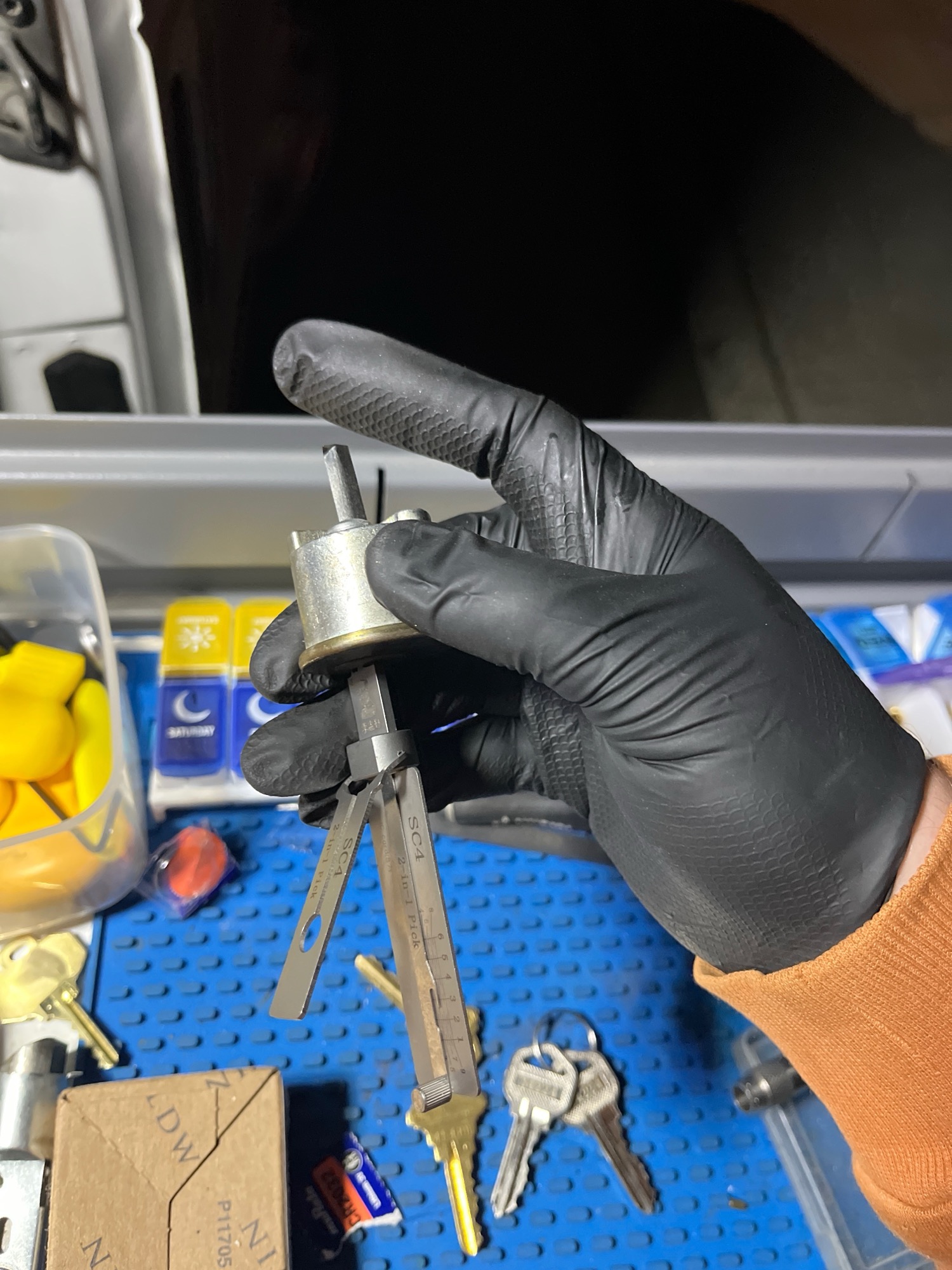 Cutting a new key on a 2-in-1 pick tool with an extracted door lock cylinder