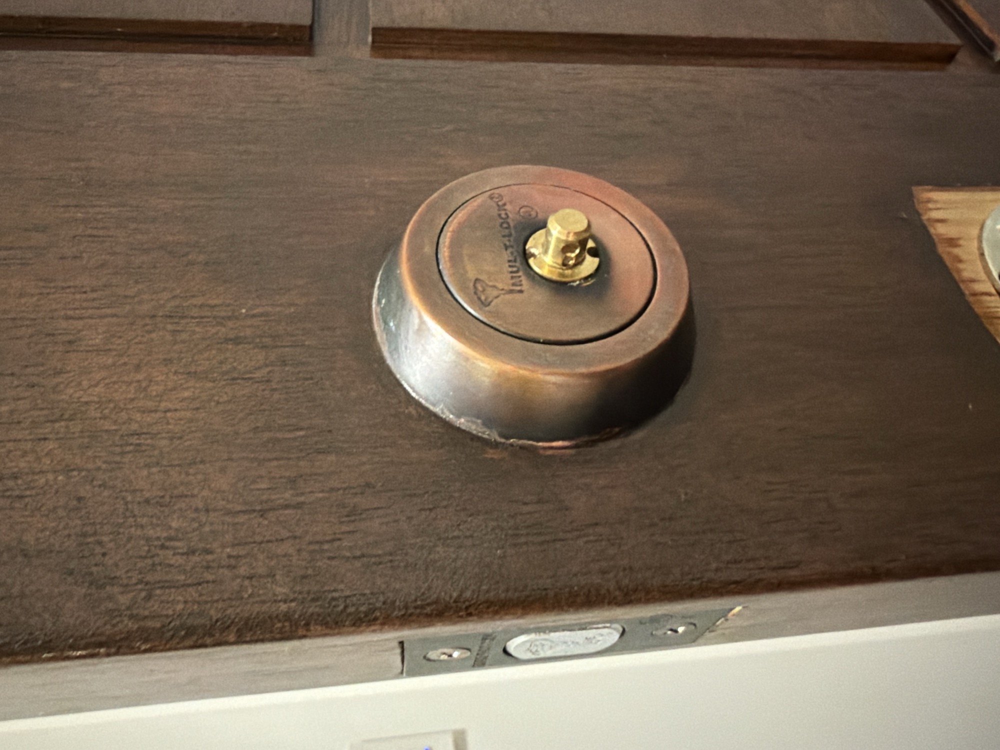 Rekeyed Schlage electronic keypad deadbolt on a dark door
