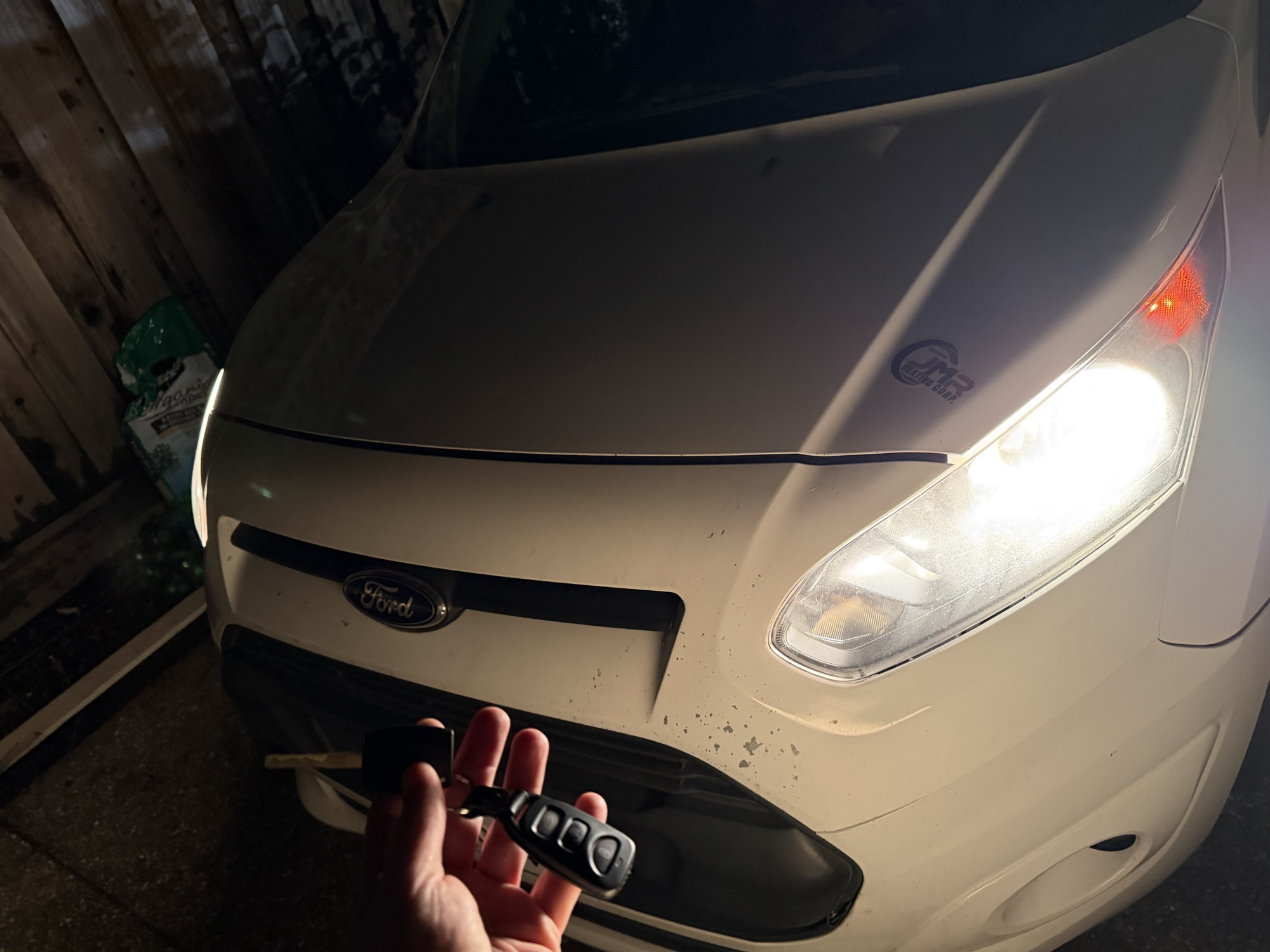 Replacement key fob for a white Ford Transit Connect van