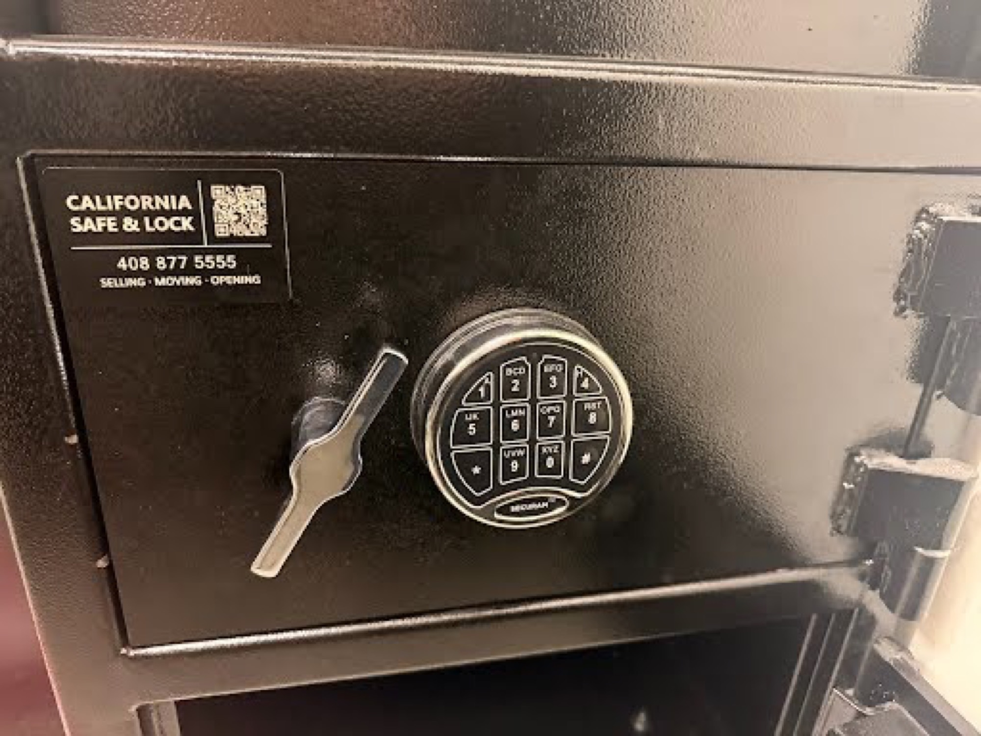 Electronic keypad combination lock on a commercial floor safe