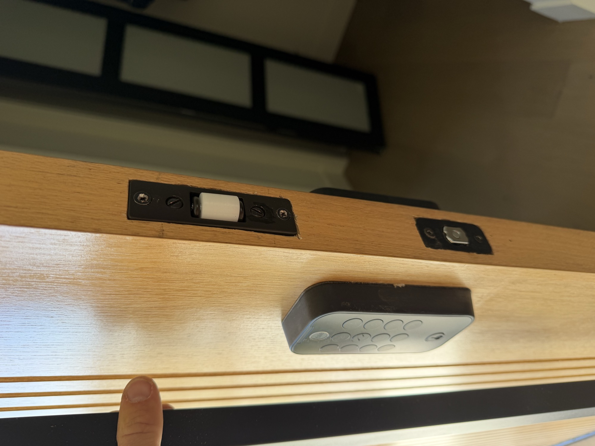 Electronic keypad lock and mortise latch installed on a wood door edge