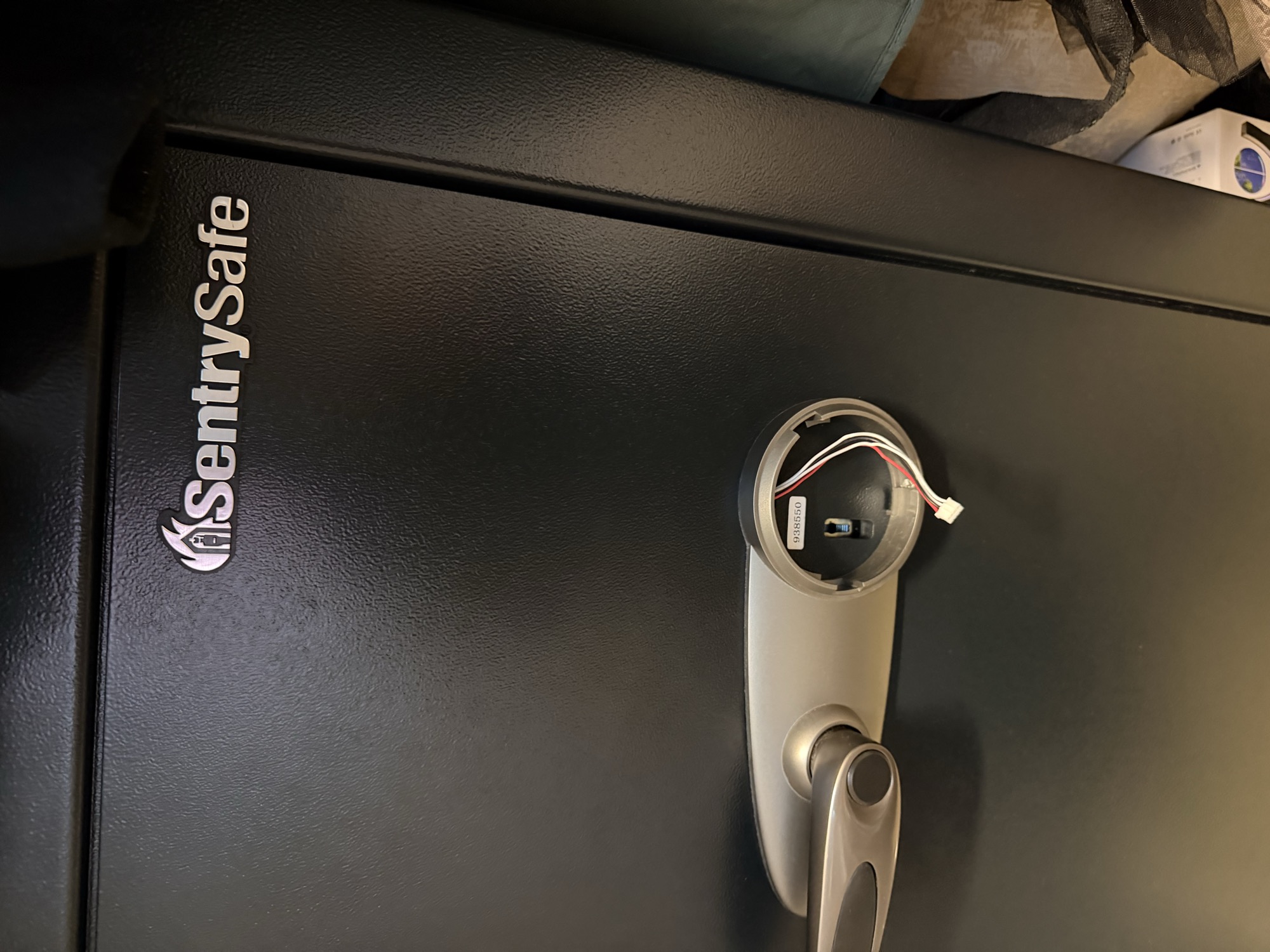 Electronic keypad lock mechanism exposed inside a SentrySafe security cabinet