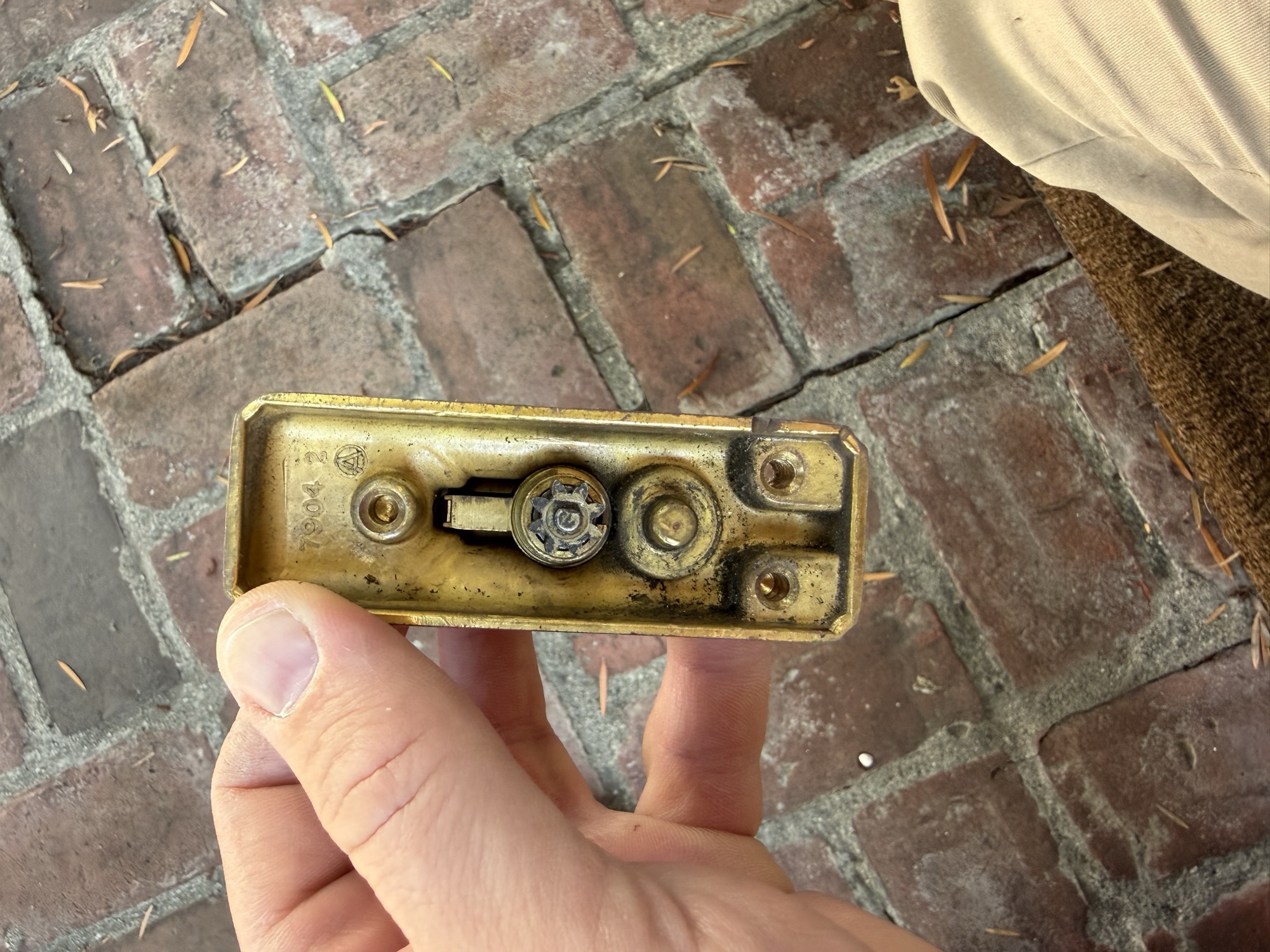 Interior mortise lock hardware removed from an antique brass door lock