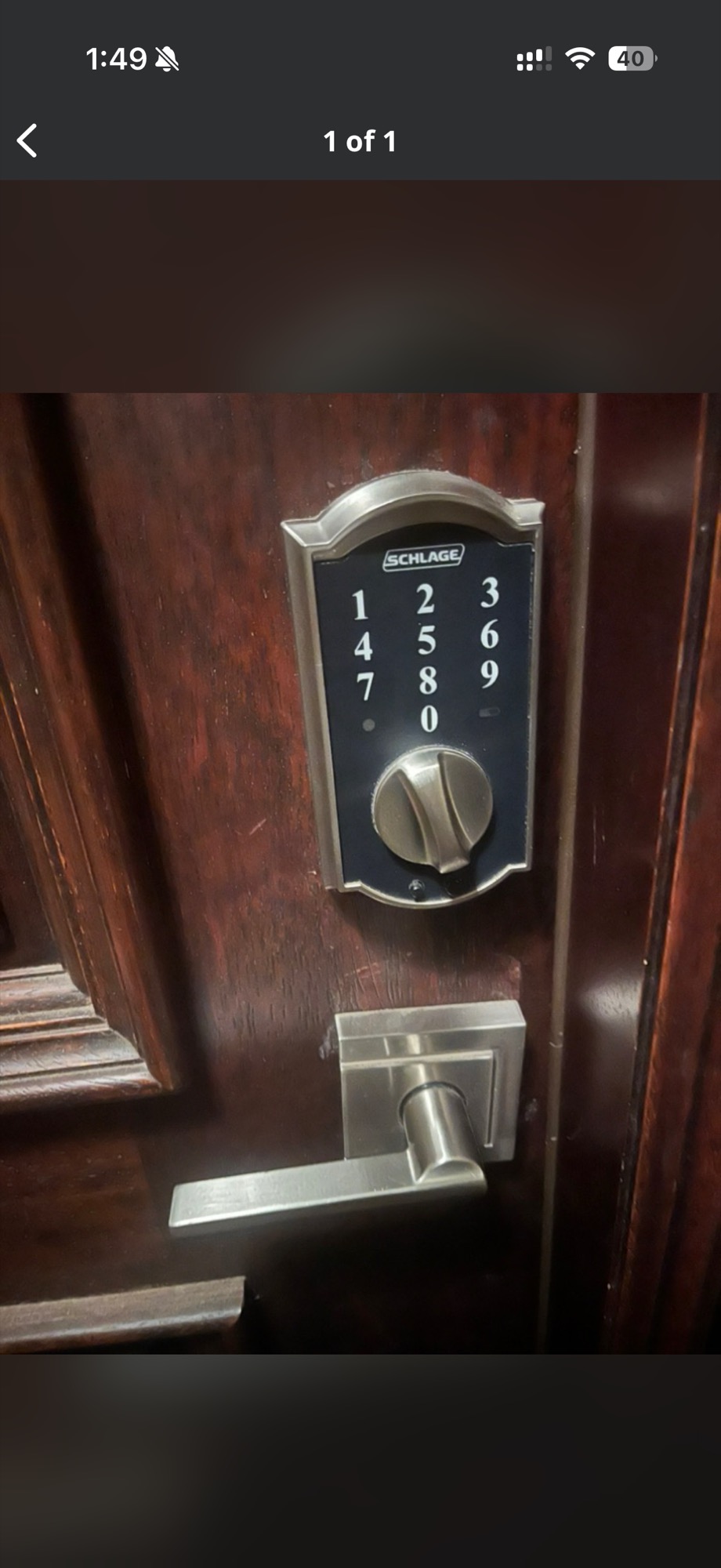 Schlage keypad deadbolt with lever handle on a dark wood door