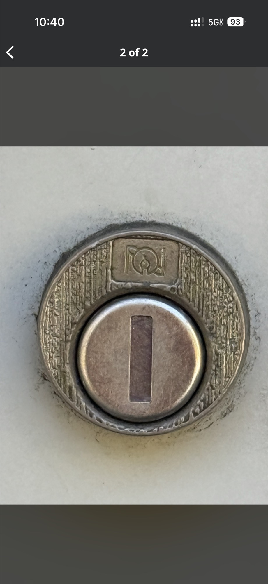 Close-up of a scratched key-in-knob lock cylinder face